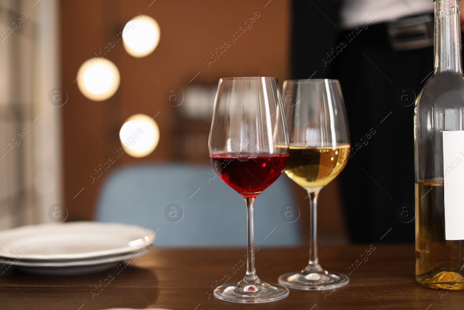 Photo of Glasses with tasty wine on table in restaurant