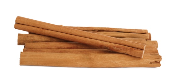 Aromatic dry cinnamon sticks on white background