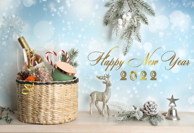 Image of Happy New 2022 Year! Wicker basket with gift set and decor on wooden table