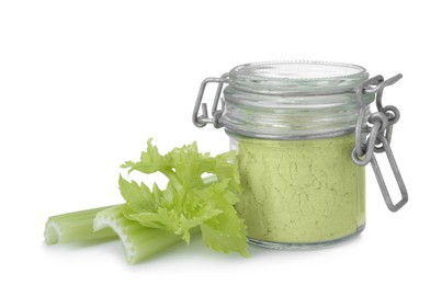 Photo of Glass jar of celery powder and fresh cut stalk isolated on white