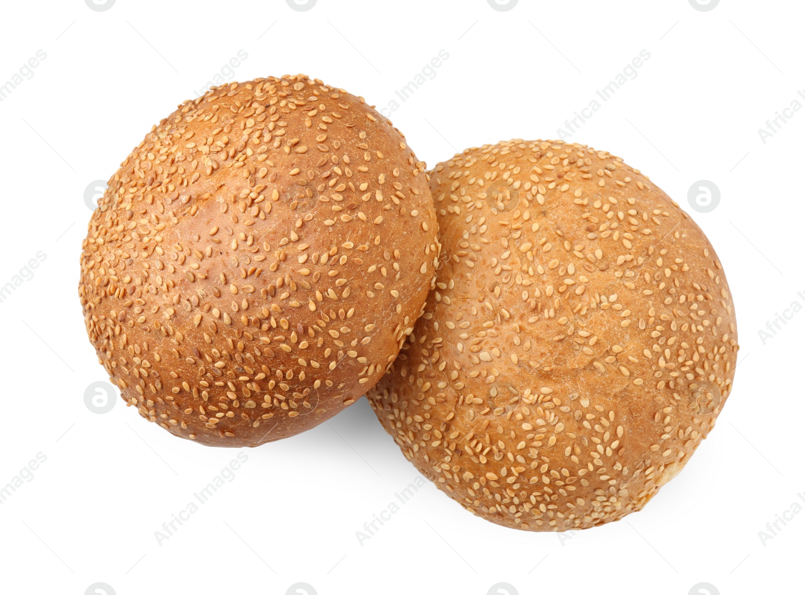 Photo of Fresh hamburger buns with sesame seeds isolated on white, top view