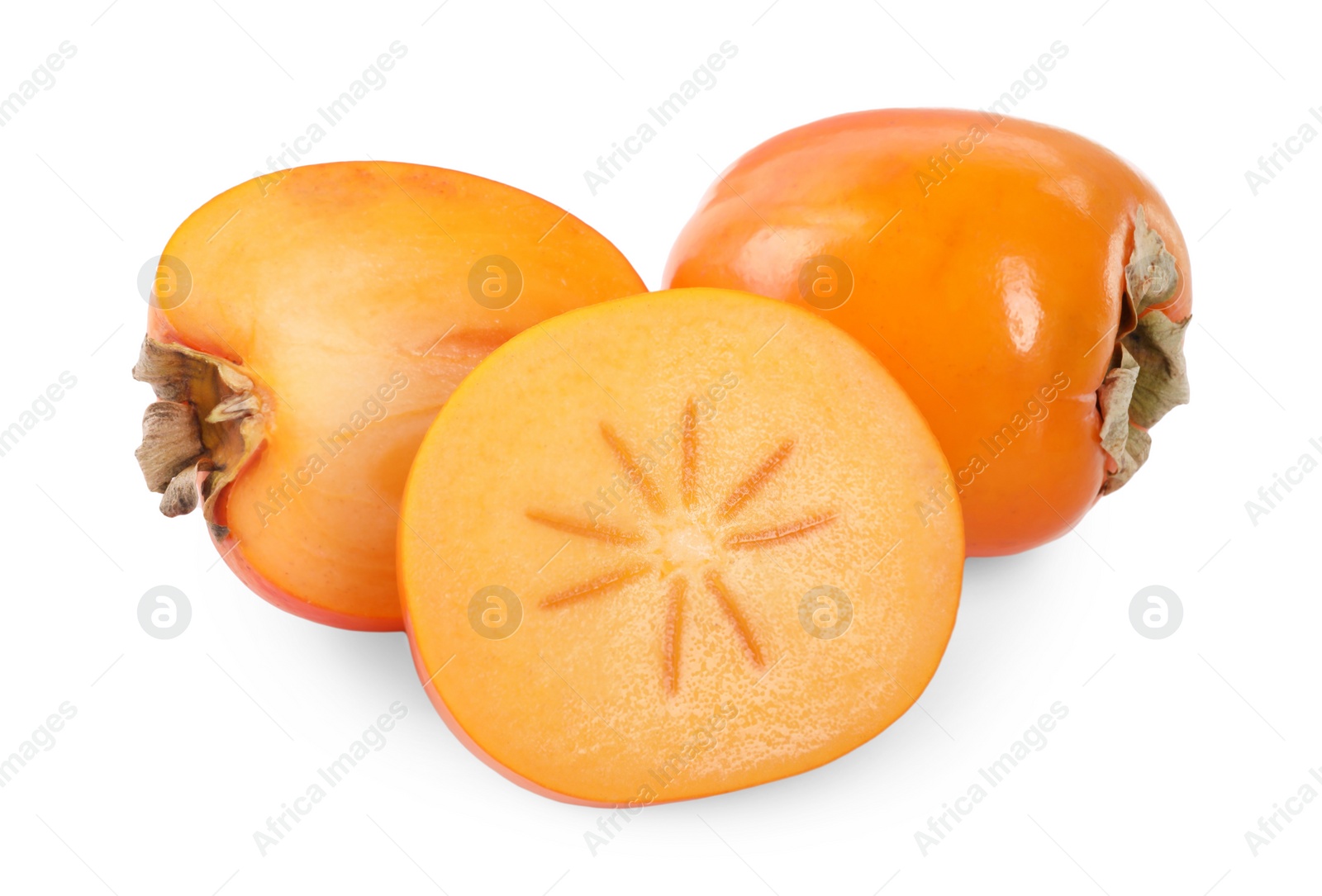 Photo of Whole and cut persimmon fruits isolated on white