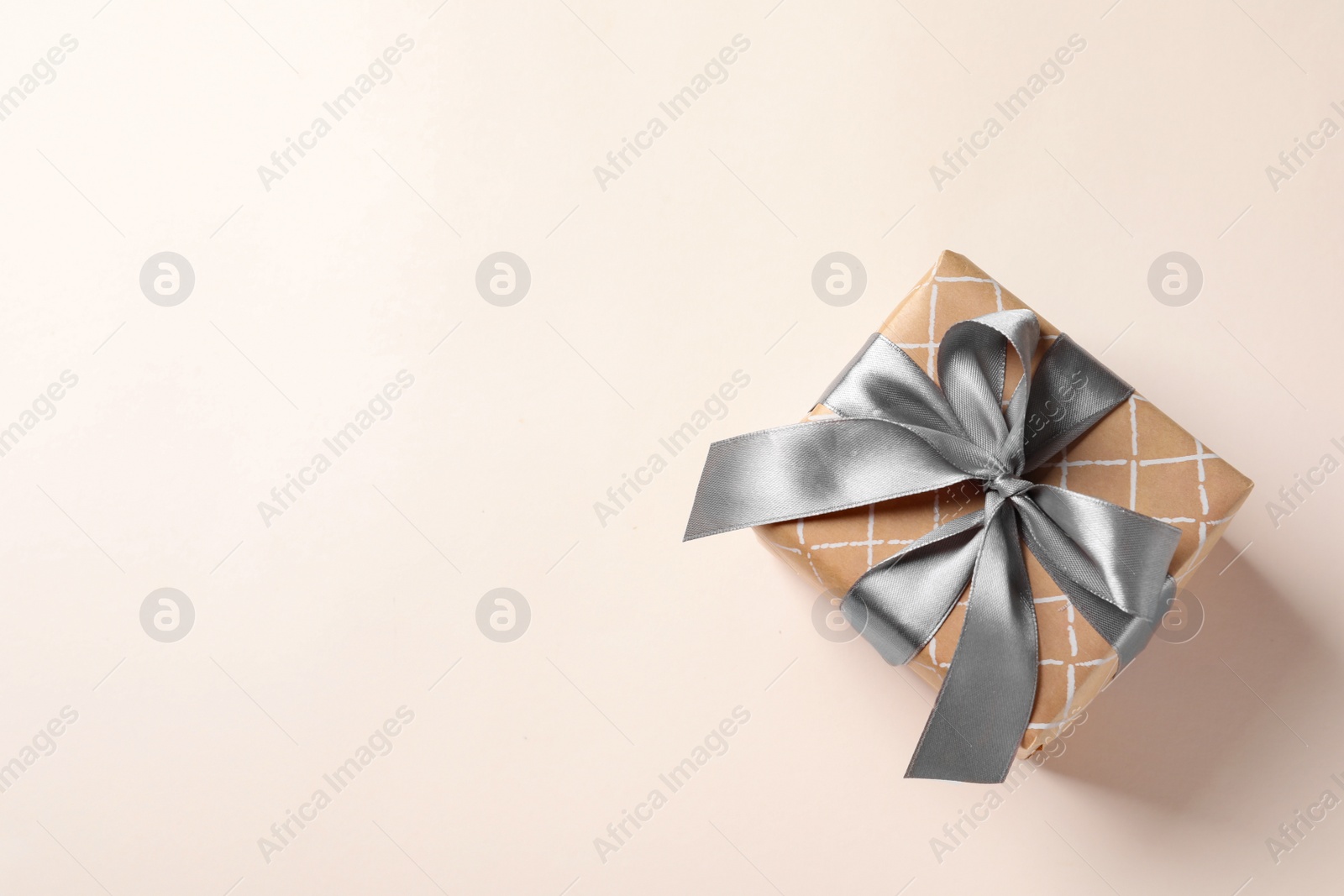 Photo of Beautiful gift box on light background, top view