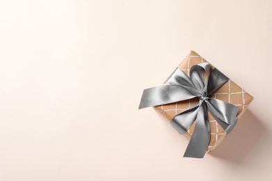 Photo of Beautiful gift box on light background, top view