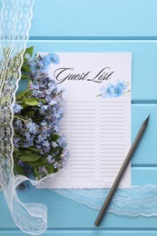 Guest list, pencil, lace ribbon and flowers on light blue wooden table, flat lay. Space for text