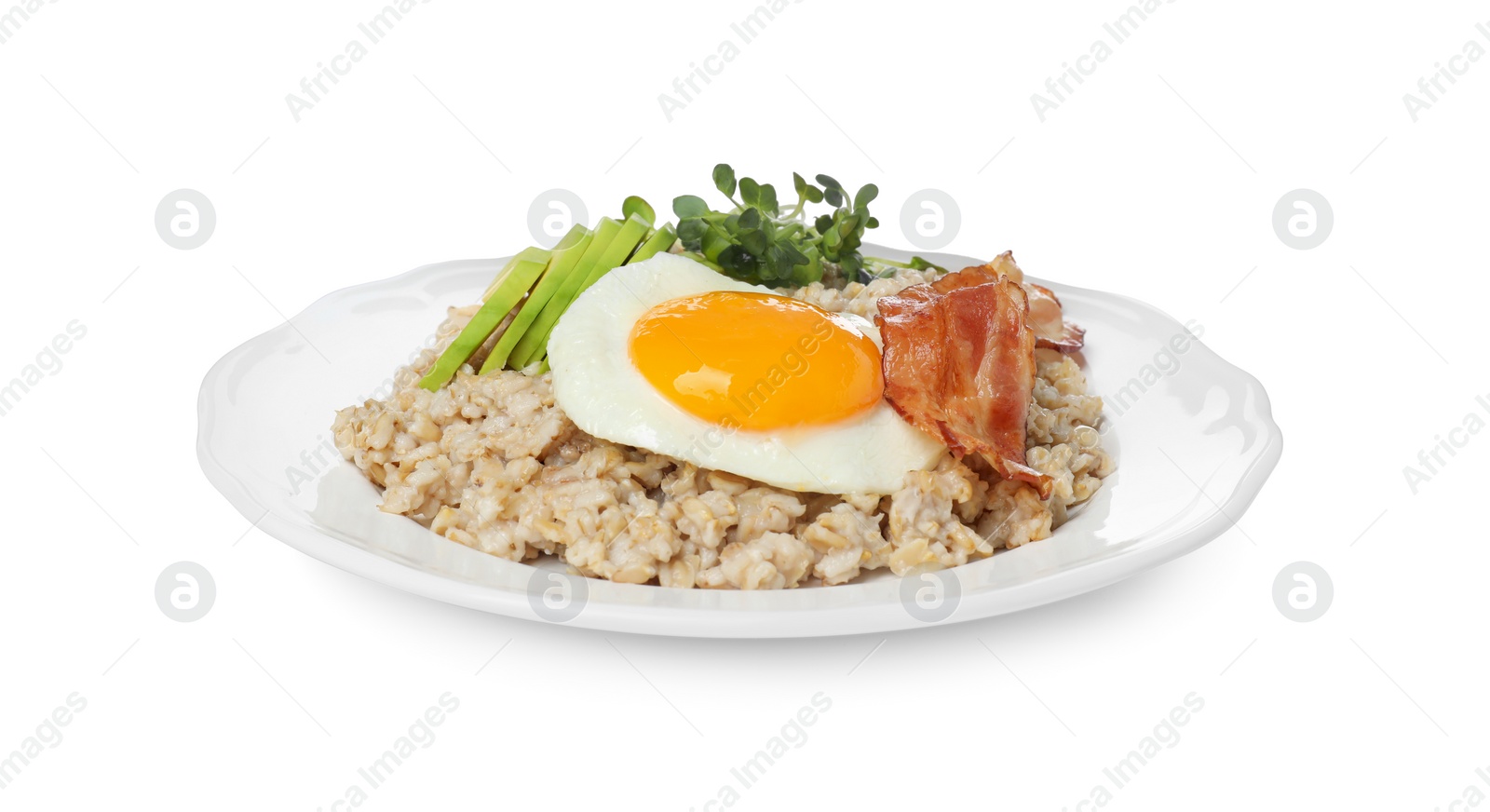 Photo of Tasty boiled oatmeal with fried egg, avocado and bacon isolated on white