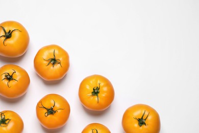 Photo of Fresh ripe yellow tomatoes on white background, top view