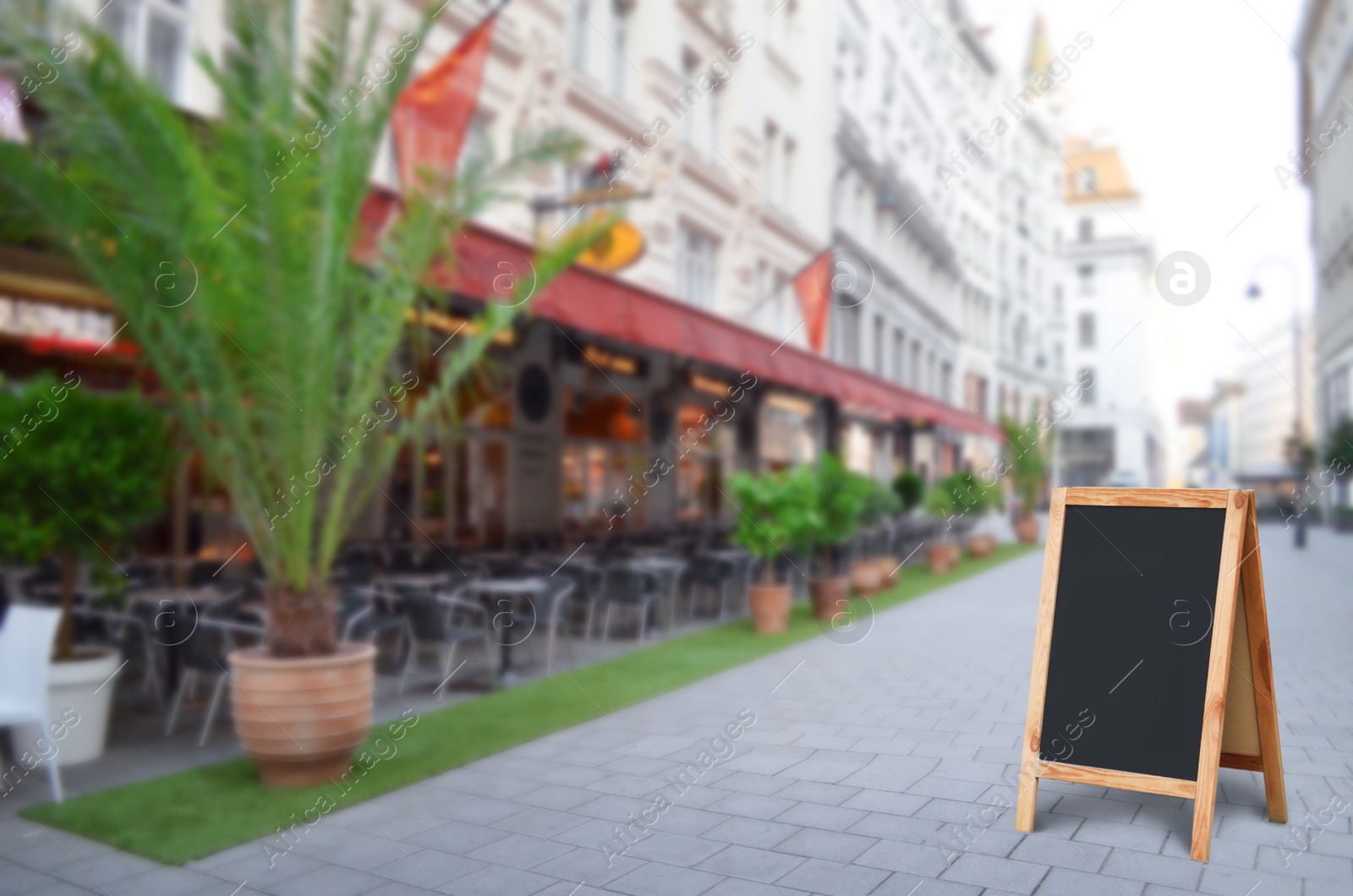 Image of Blank advertising board on city street. Space for text