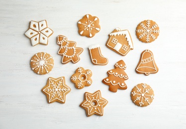 Tasty homemade Christmas cookies on wooden background, top view