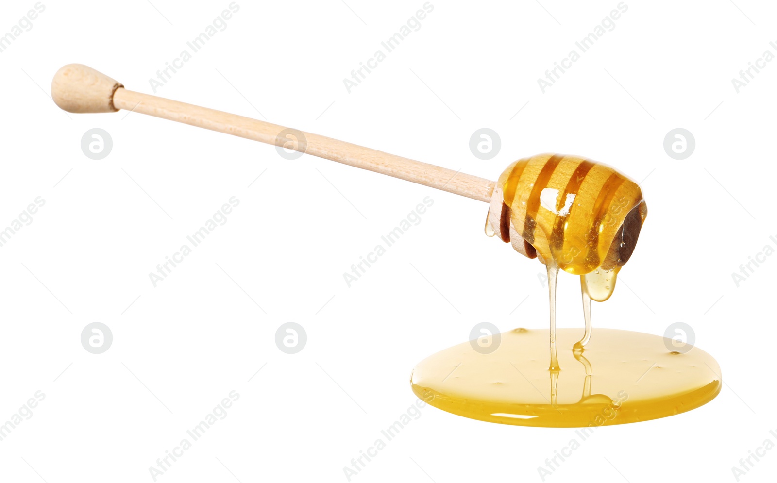 Photo of Natural honey dripping from dipper on white background