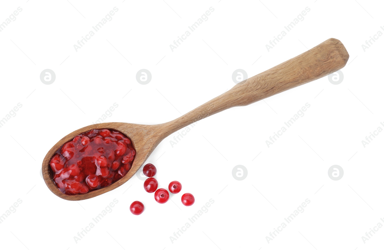 Photo of Spoon with tasty cranberry sauce and fresh berries isolated on white, top view