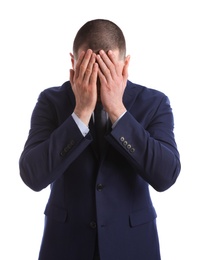 Photo of Man in suit closing his face with hands on white background