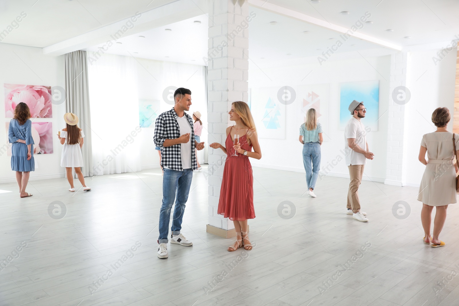 Photo of Group of people at exhibition in art gallery