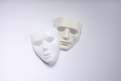 Theater arts. Two masks on white background, top view