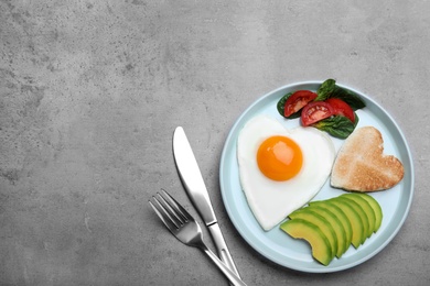 Romantic breakfast on grey table, flat lay with space for text. Valentine's day celebration