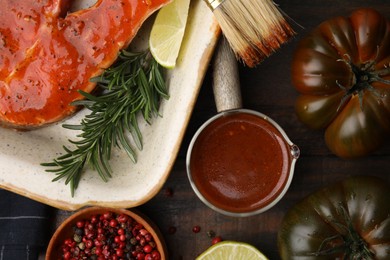 Photo of Fresh marinade, fish and other products on wooden table, flat lay