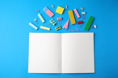 Photo of Flat lay composition with school stationery on light blue background. Back to school