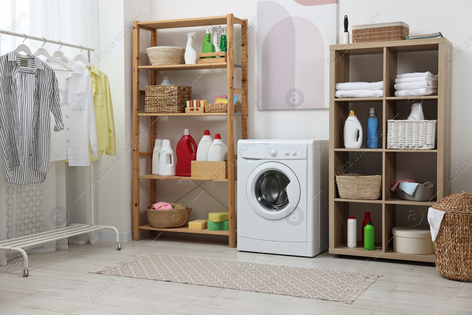 Photo of Laundry room interior with washing machine and furniture