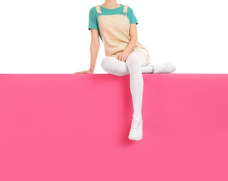 Photo of Woman wearing white tights and stylish shoes sitting on color background, closeup