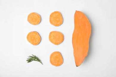 Photo of Composition with slices of sweet potatoes on white background, top view