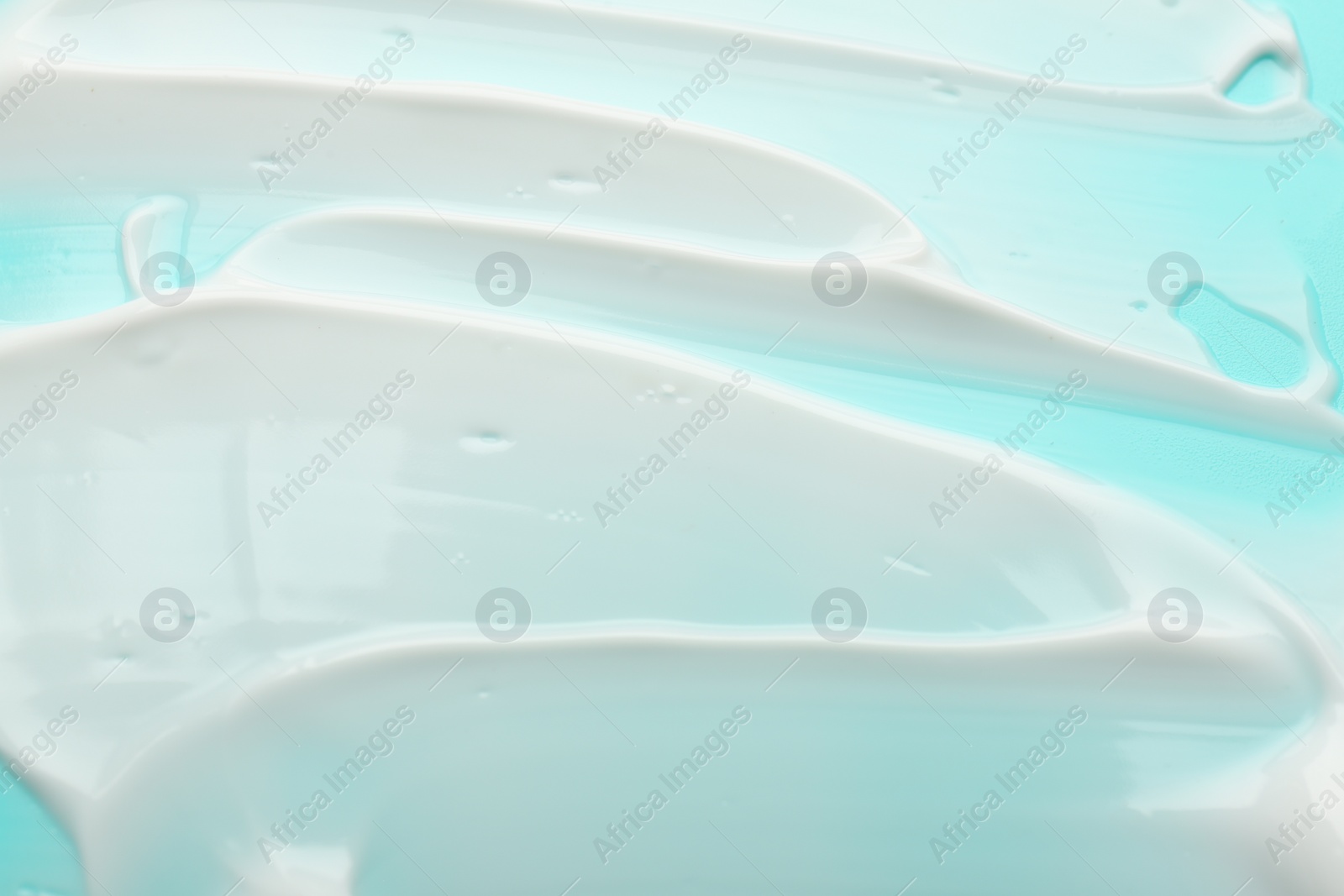 Photo of Face cream on light blue background, closeup