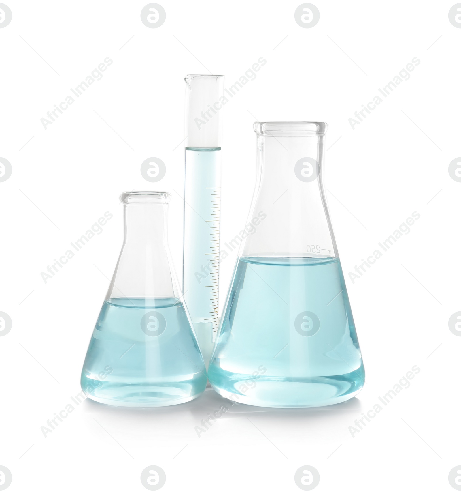 Photo of Laboratory glassware with liquid on white background. Chemical analysis