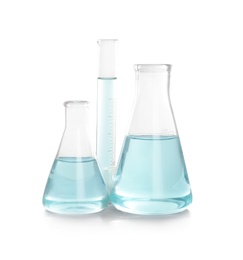 Laboratory glassware with liquid on white background. Chemical analysis