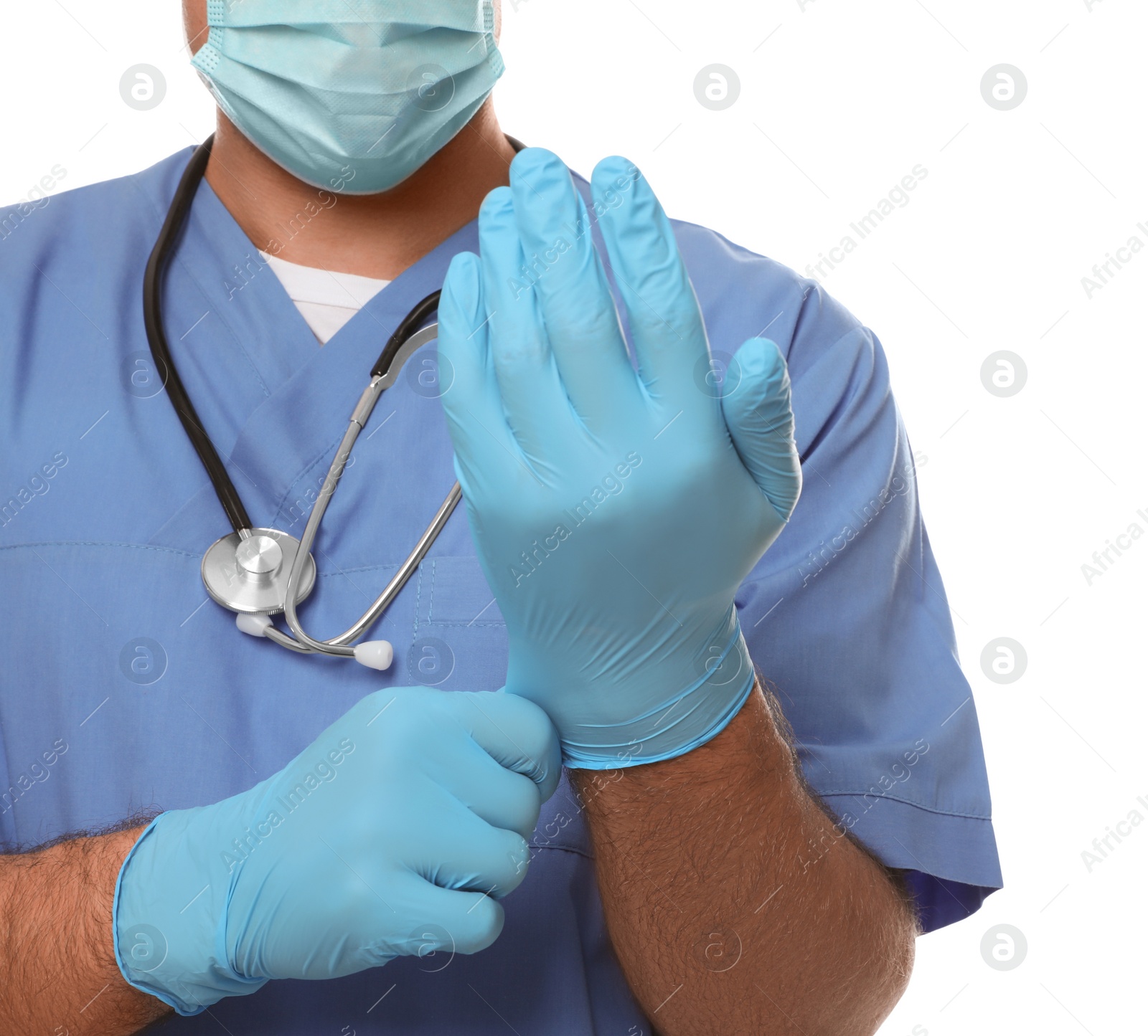 Photo of Doctor in protective mask putting on medical gloves against white background, closeup