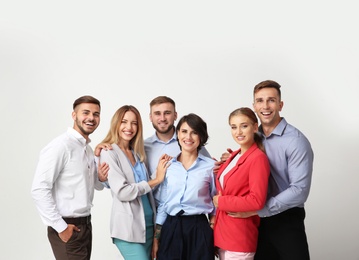 Group of young people on light background. Teamwork concept