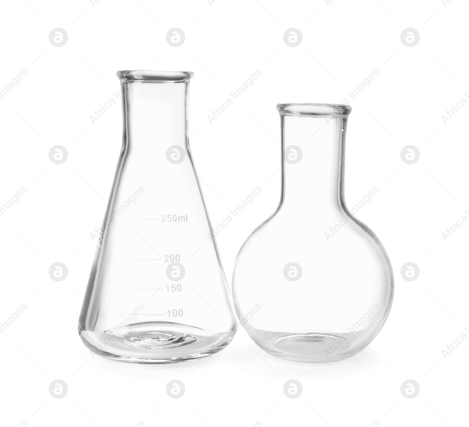 Photo of Two empty laboratory flasks isolated on white