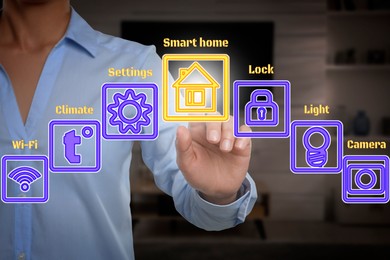 Smart home system. Woman using digital interface in room, closeup