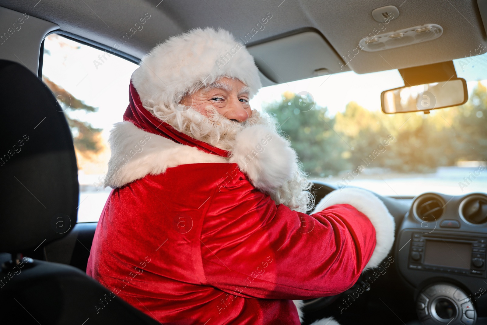 Photo of Authentic Santa Claus driving car, view from inside