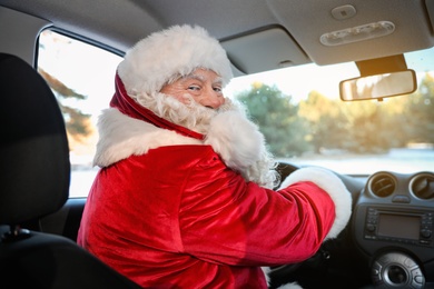 Photo of Authentic Santa Claus driving car, view from inside