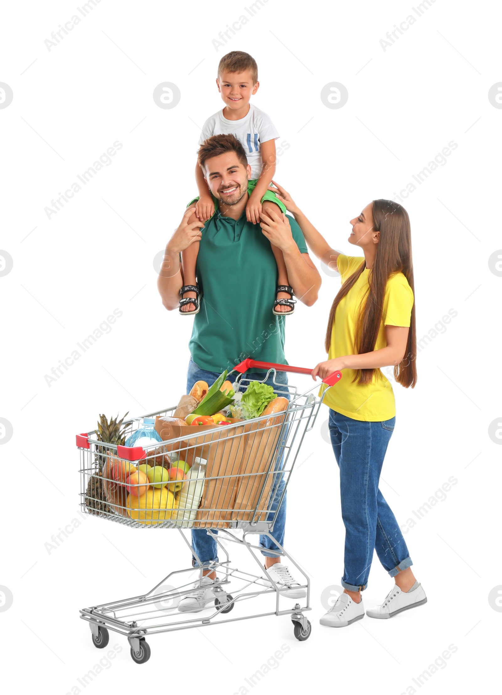 Photo of Happy family with full shopping cart on white background