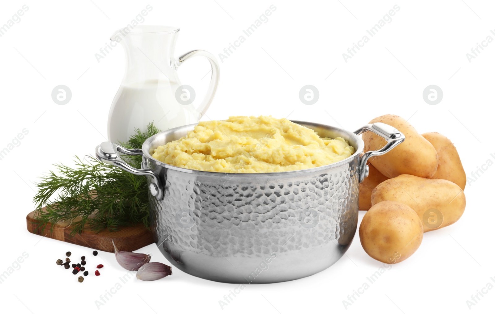 Photo of Pot of tasty mashed potatoes near ingredients on white background