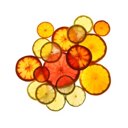 Photo of Illuminated slices of citrus fruits on white background, top view