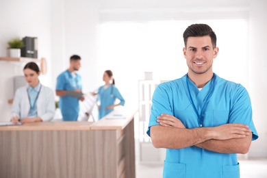 Portrait of male doctor in modern clinic