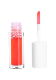 Photo of Bright lip gloss and applicator isolated on white. Cosmetic product