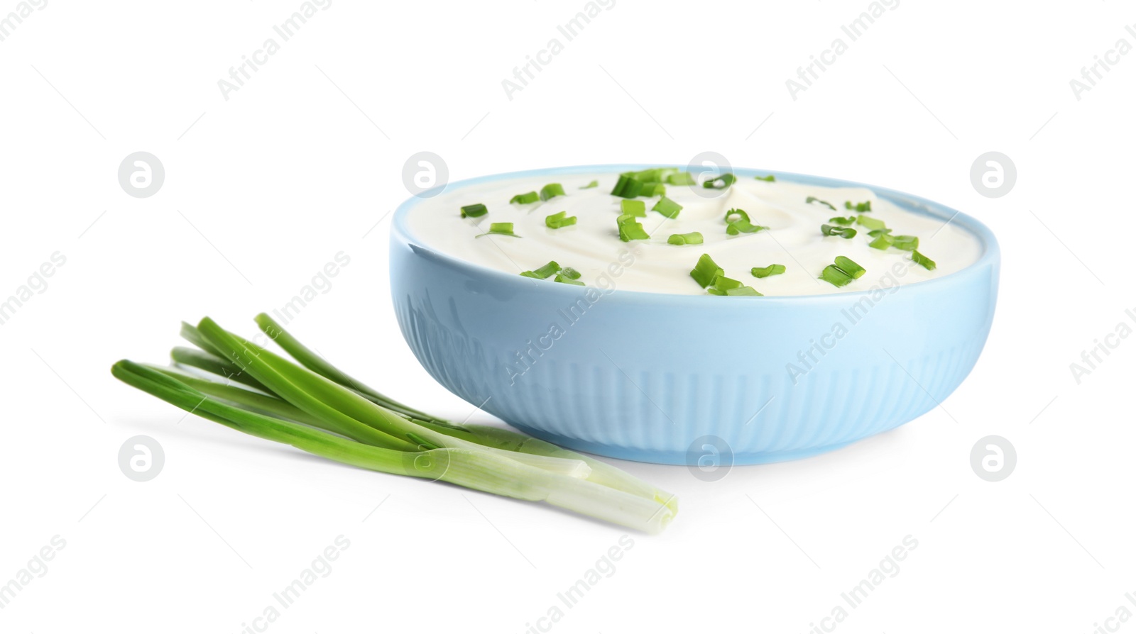 Photo of Fresh sour cream with onion on white background