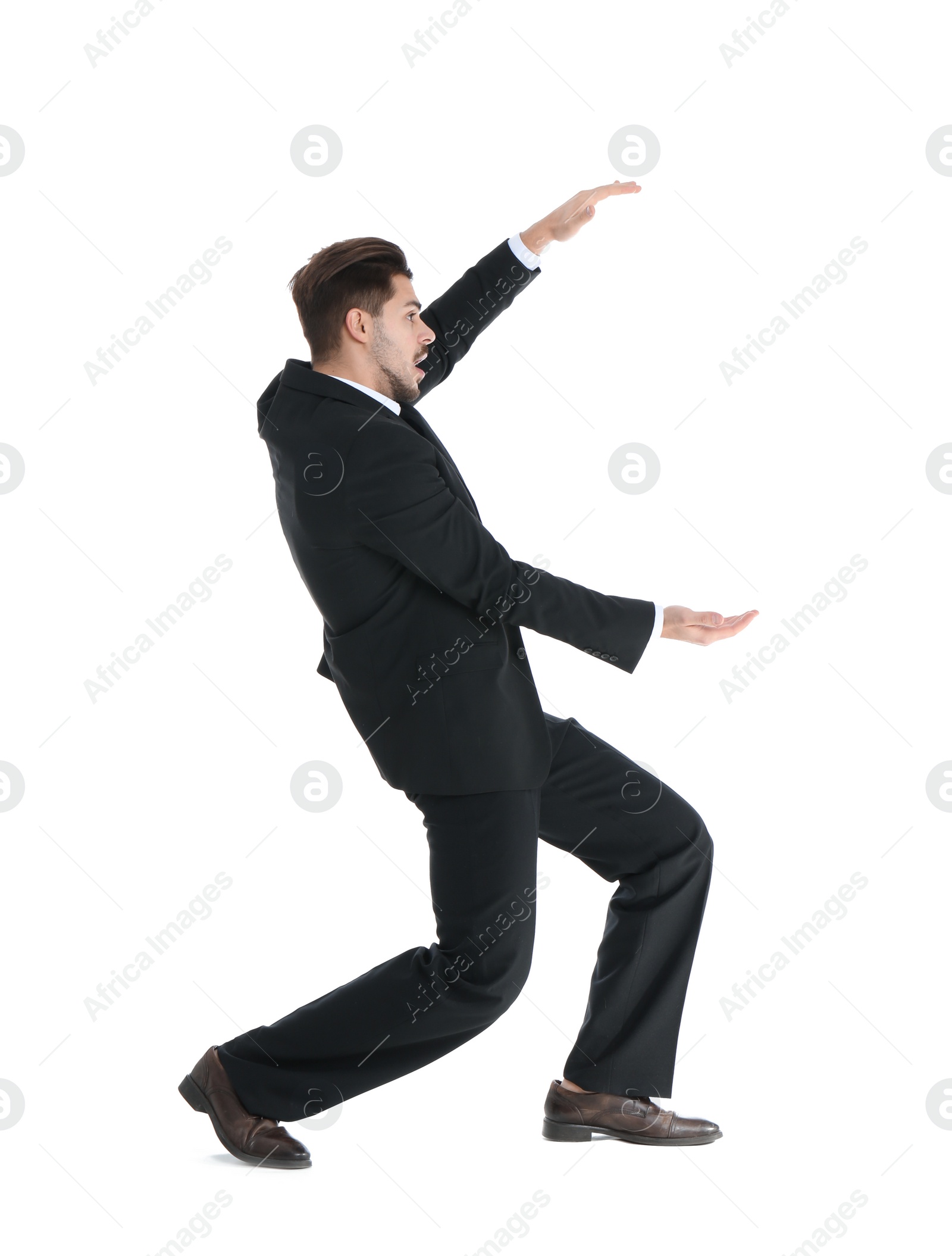 Photo of Young businessman with magnet attracting people on white background