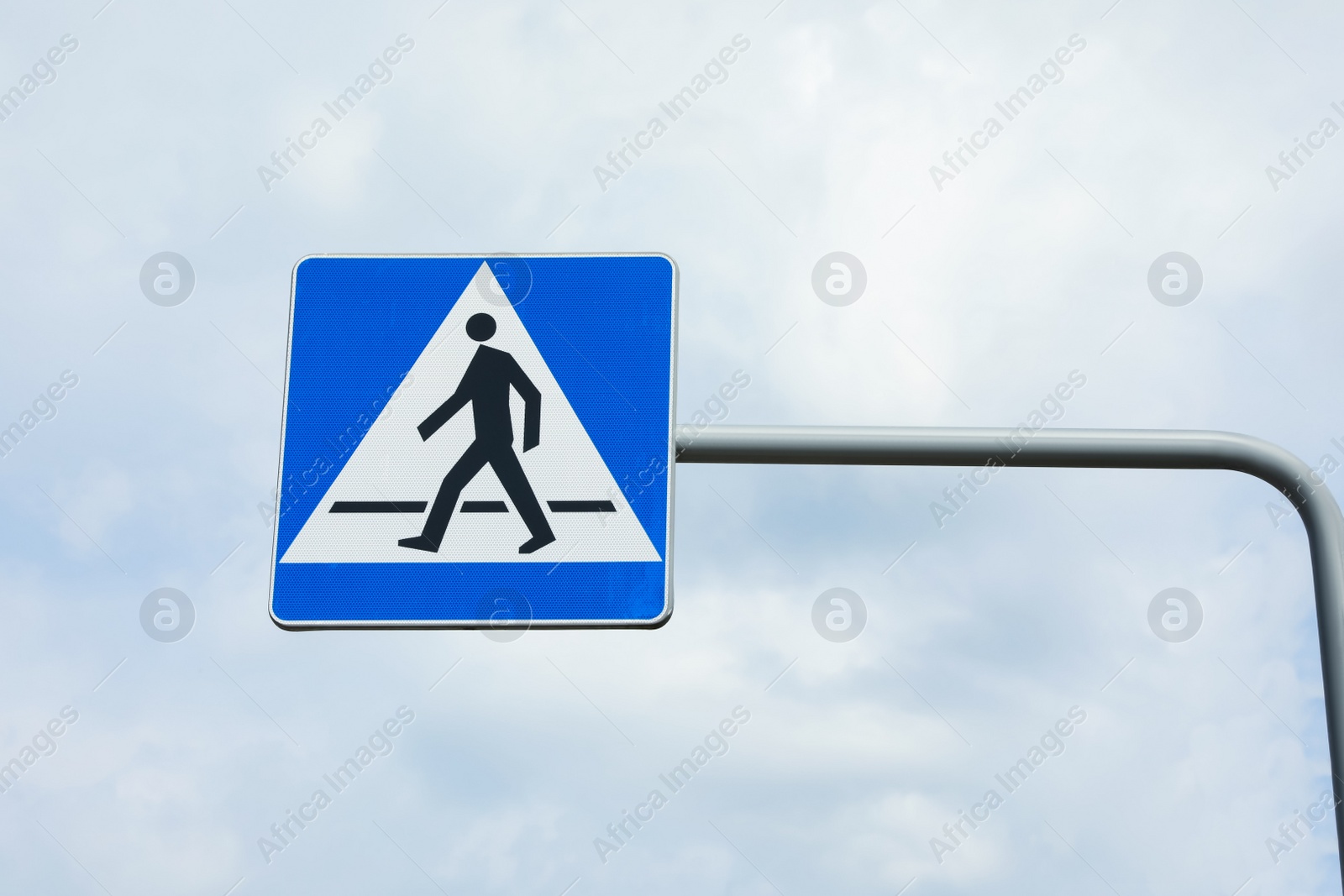 Photo of Traffic sign Pedestrian Crossing against blue sky