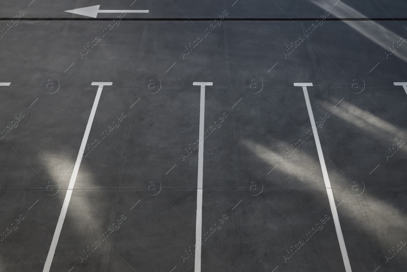 Photo of Outdoor car parking lot on sunny day, above view