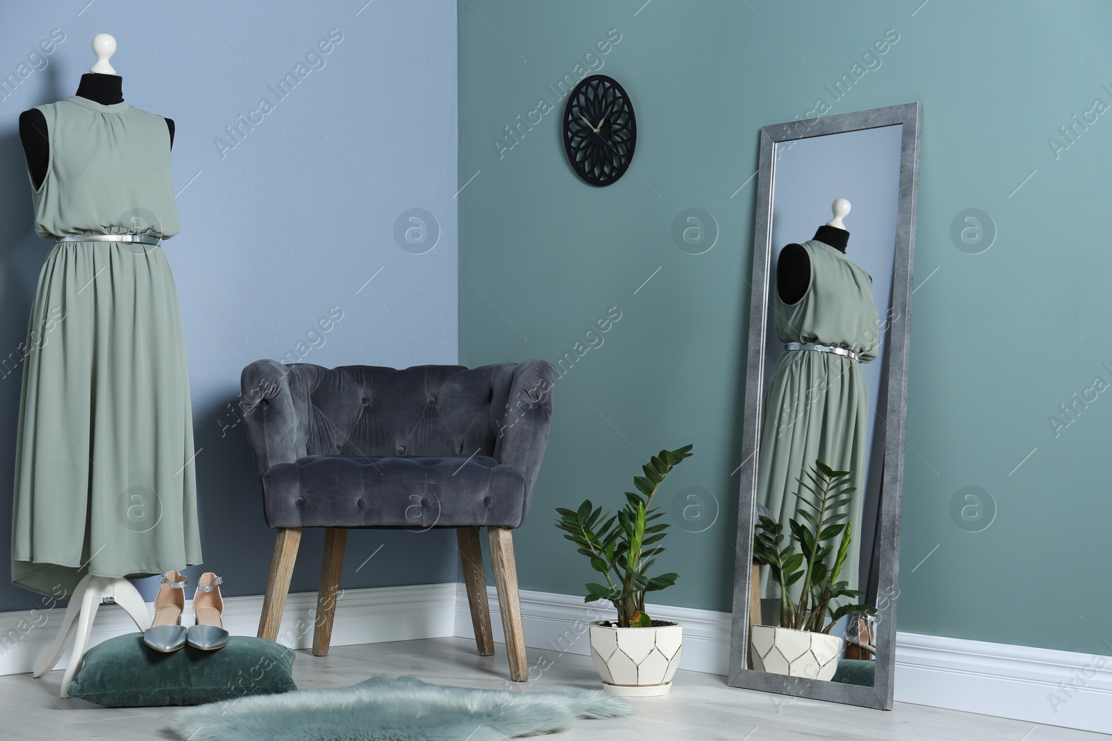 Photo of Elegant room interior with large mirror and comfortable armchair