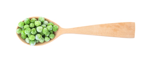 Spoon with frozen peas on white background. Vegetable preservation