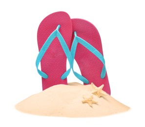 Pink flip flops in sand and starfishes on white background