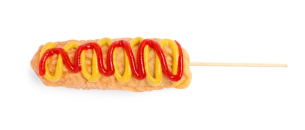 Delicious deep fried corn dog with sauces isolated on white, top view