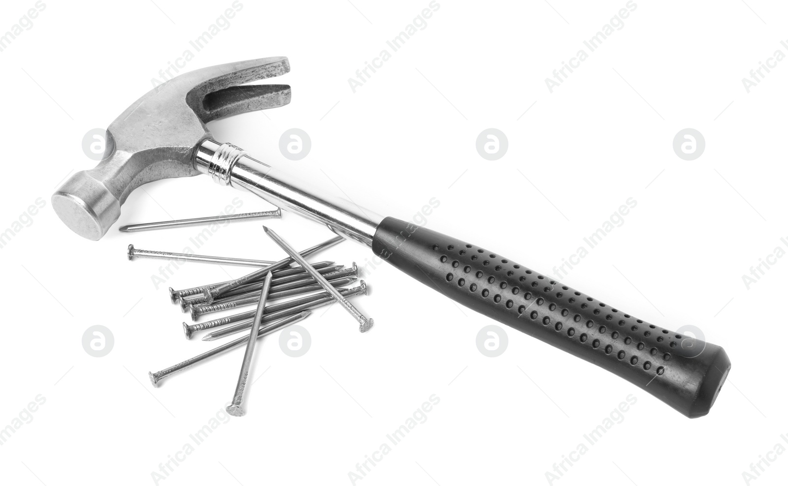 Photo of Hammer and metal nails isolated on white