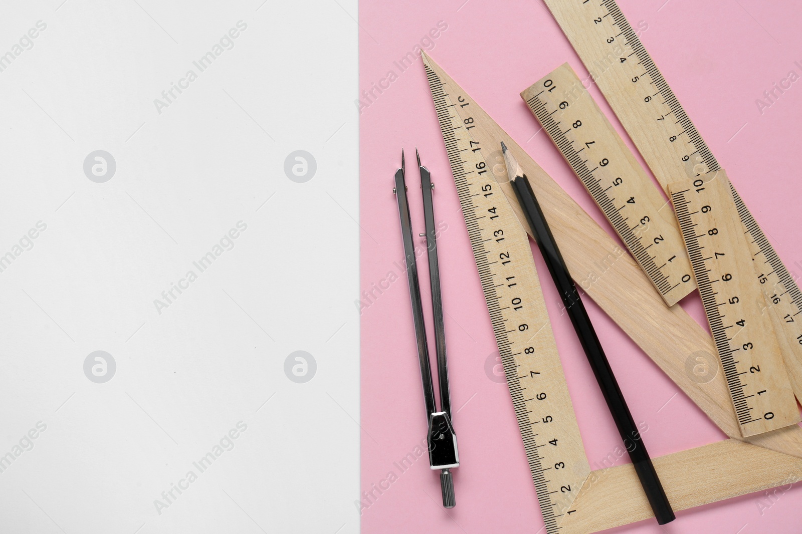 Photo of Different rulers, pencil and compass on color background, flat lay. Space for text