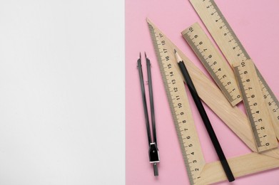Photo of Different rulers, pencil and compass on color background, flat lay. Space for text