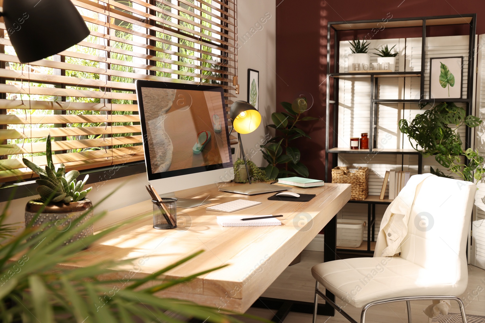 Photo of Light room interior with comfortable workplace near window